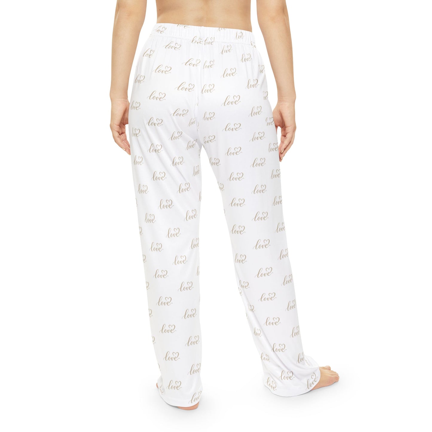 White pajama pants with gold love text pattern on a white background