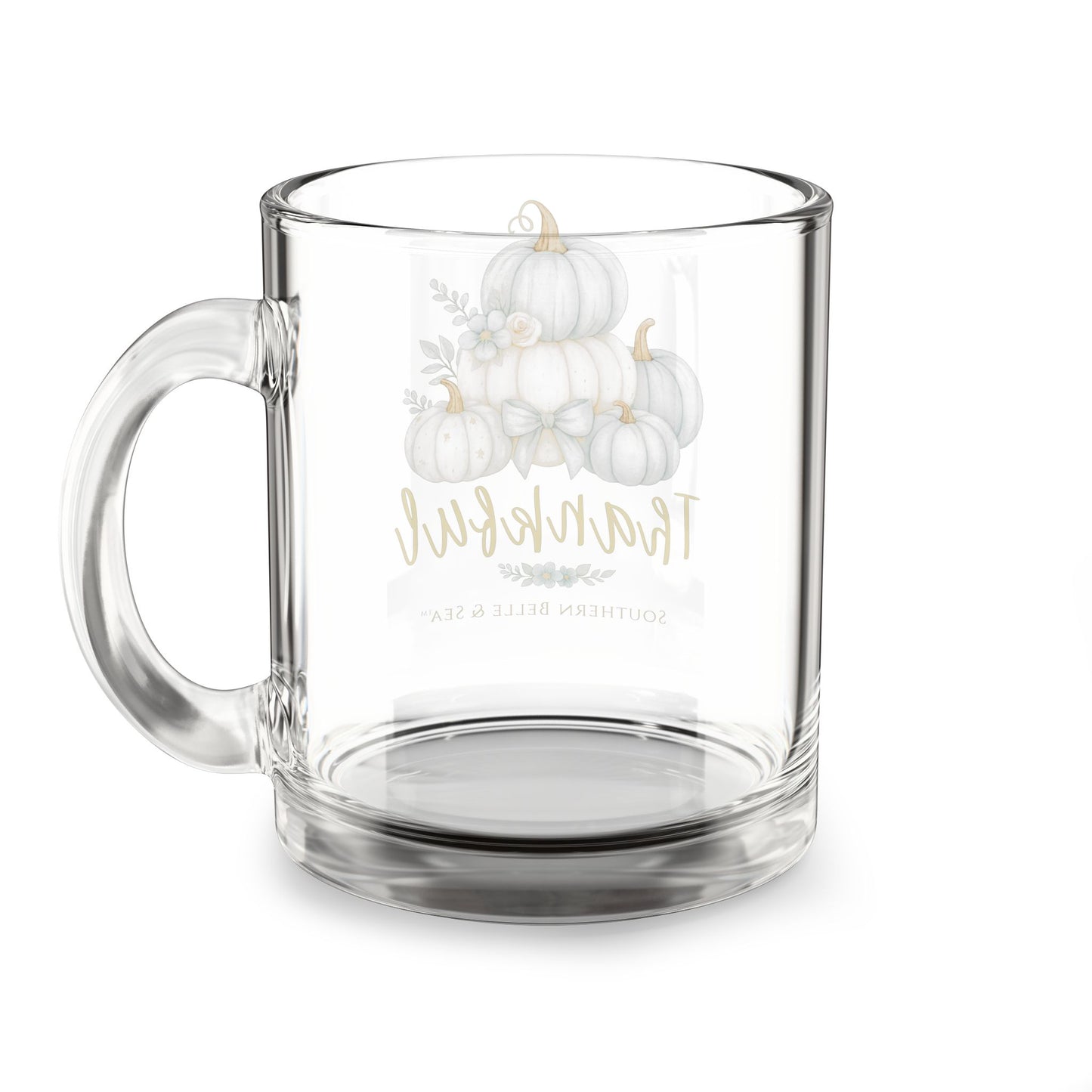 Clear glass mug with white pumpkins and text on a white background