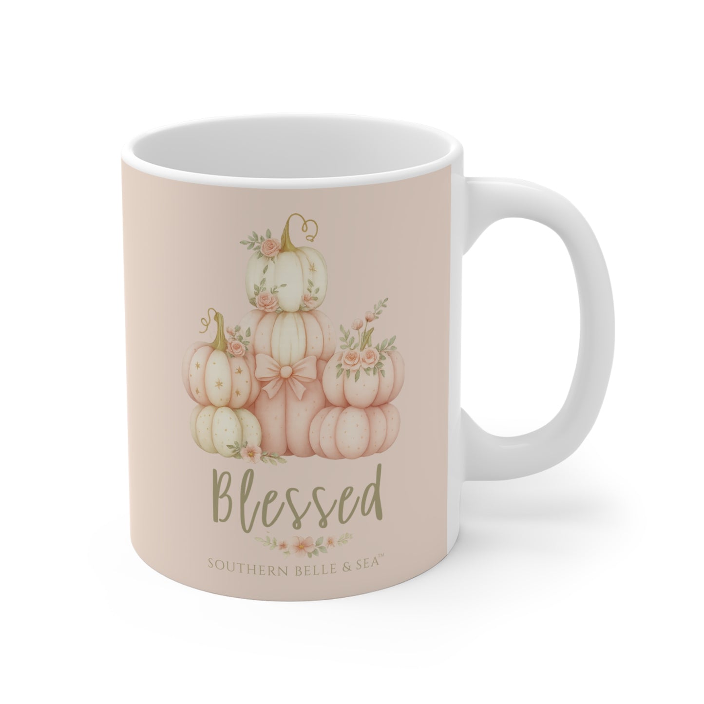 Mug with pumpkin design and 'Blessed' text on a beige background