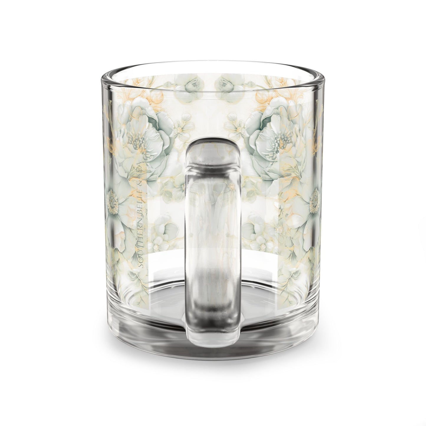 Clear glass mug with floral pattern on a white background