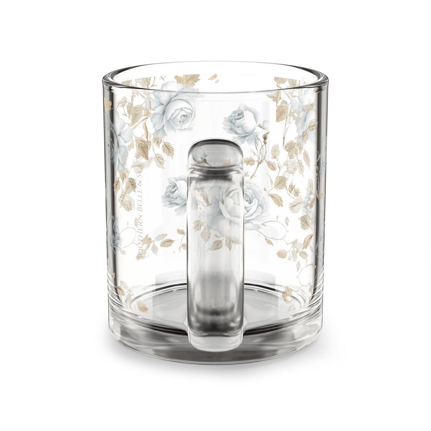 Clear glass mug with floral design and tea infuser on a white background