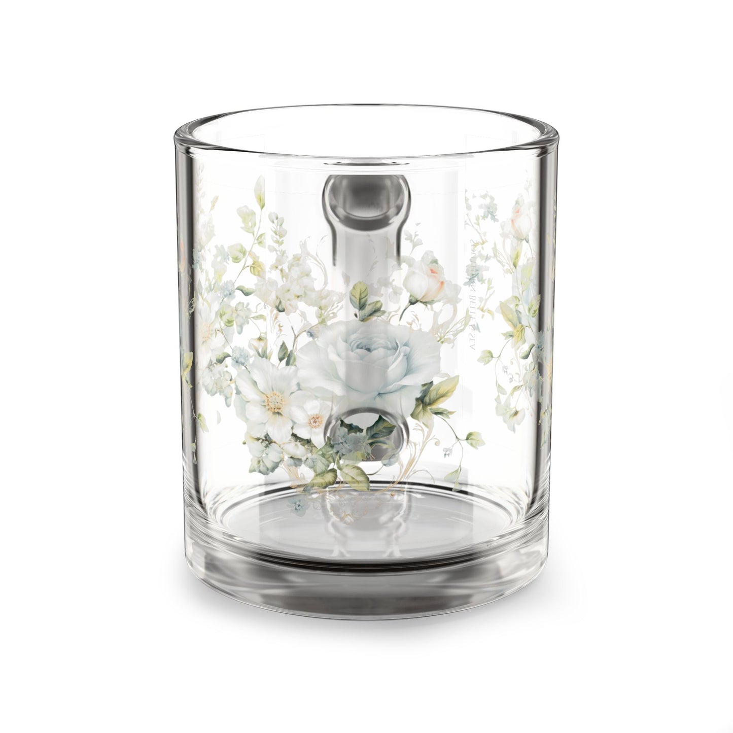 Clear glass coffee mug with floral design on a white background
