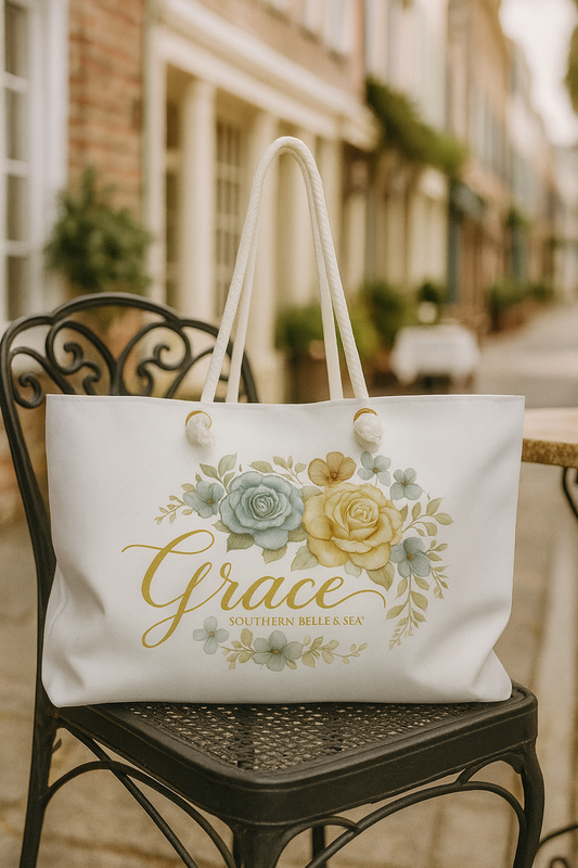 White tote bag with floral design and 'Grace' text on a chair outdoors.