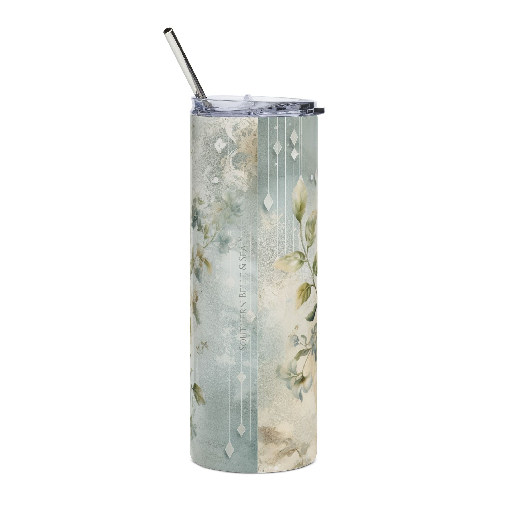 Tumbler with floral design and metal straw on a white background