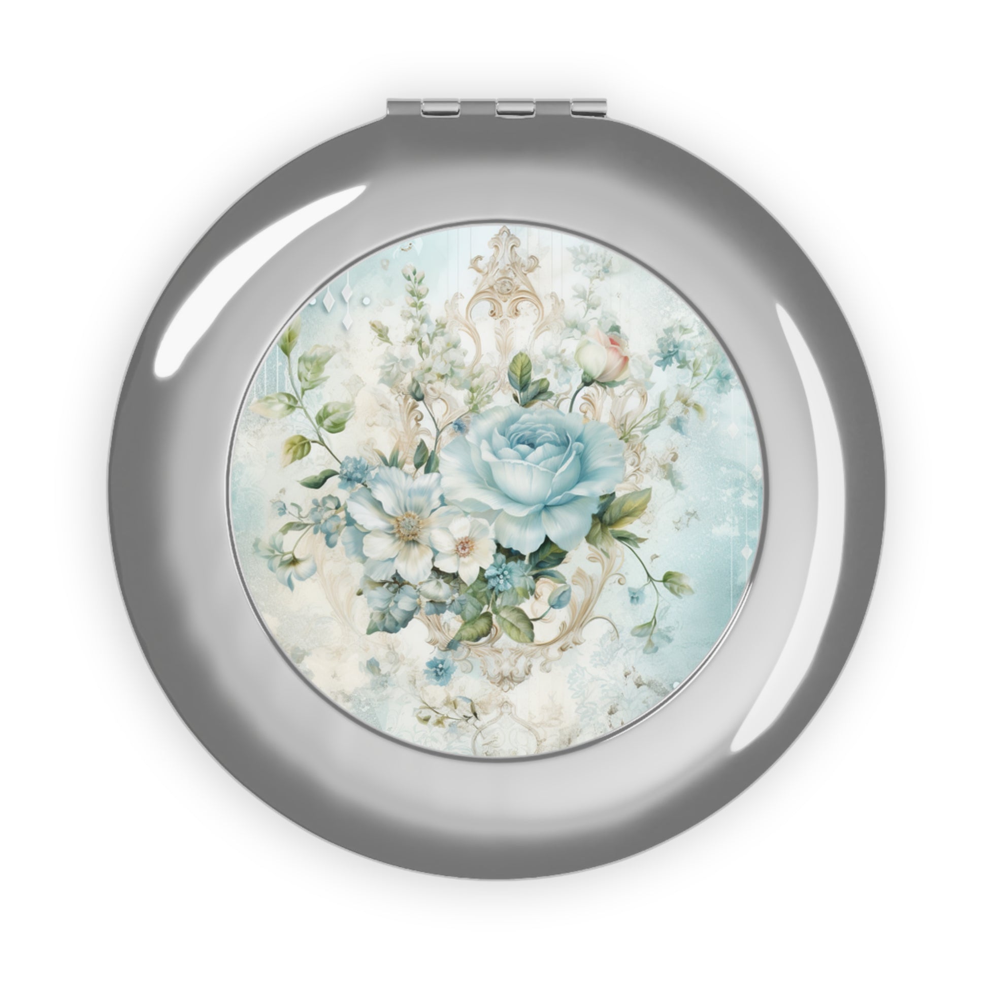 Round compact mirror with floral design on a white background
