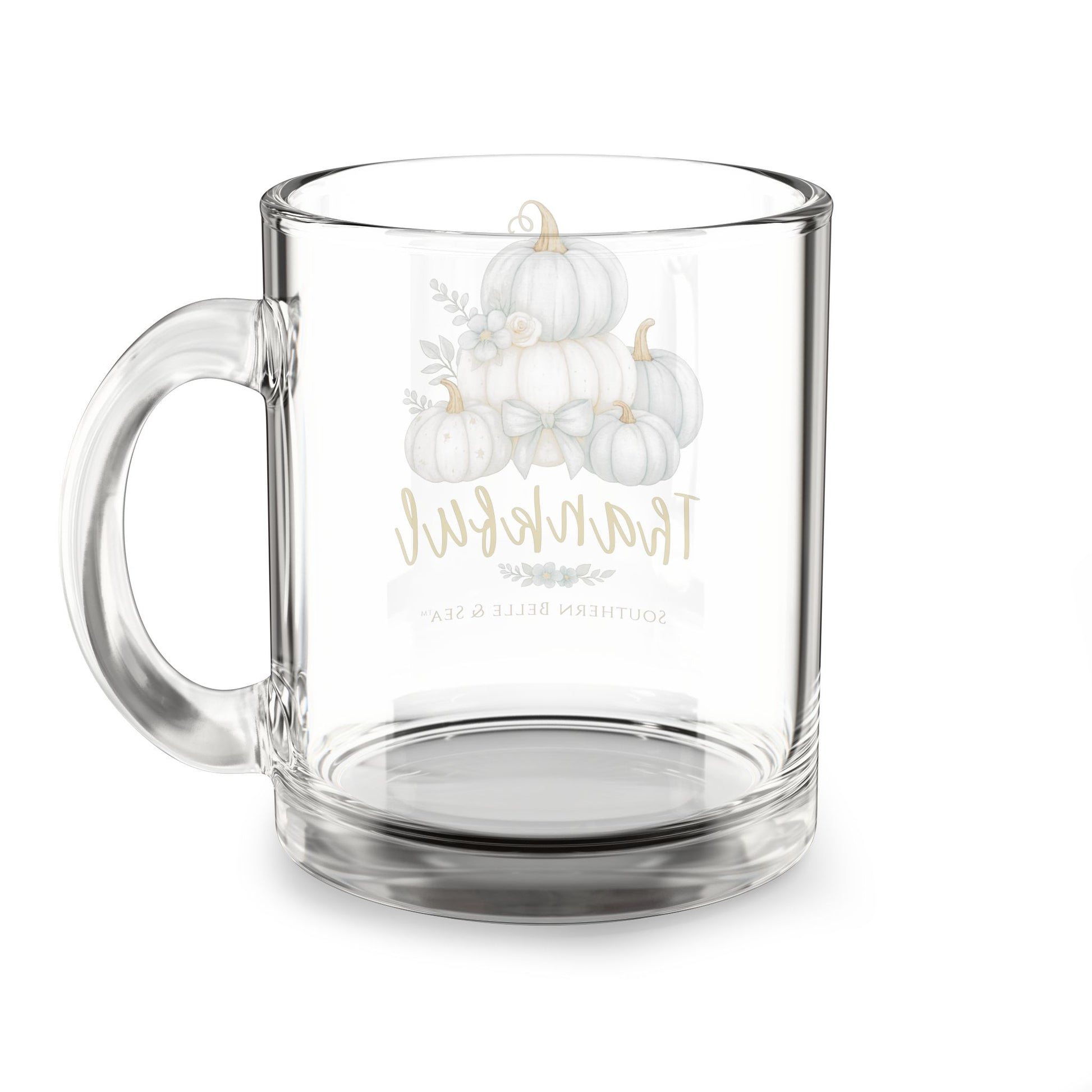 Clear glass mug with white pumpkins and text on a white background