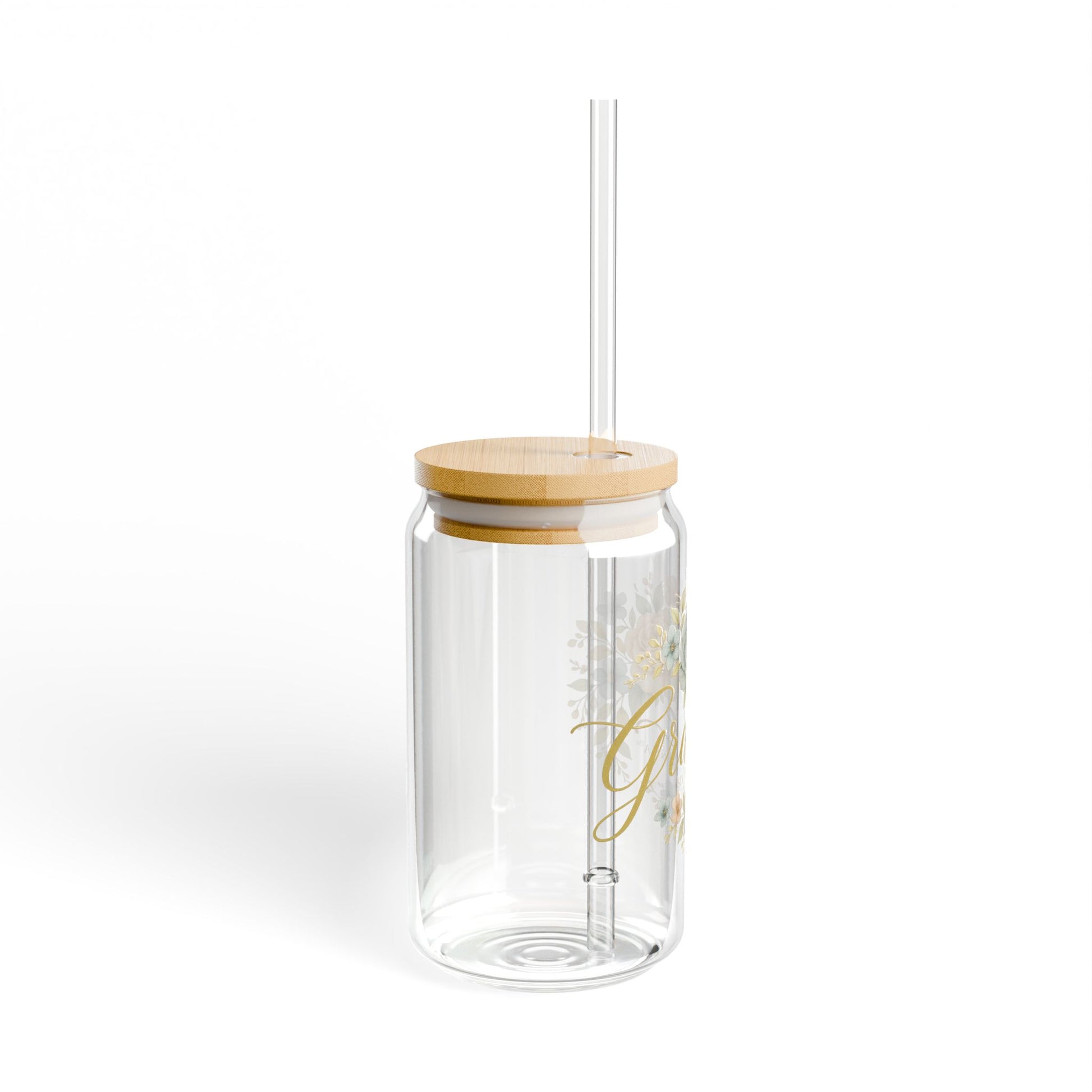 Clear glass tumbler with wooden lid and straw on a white background