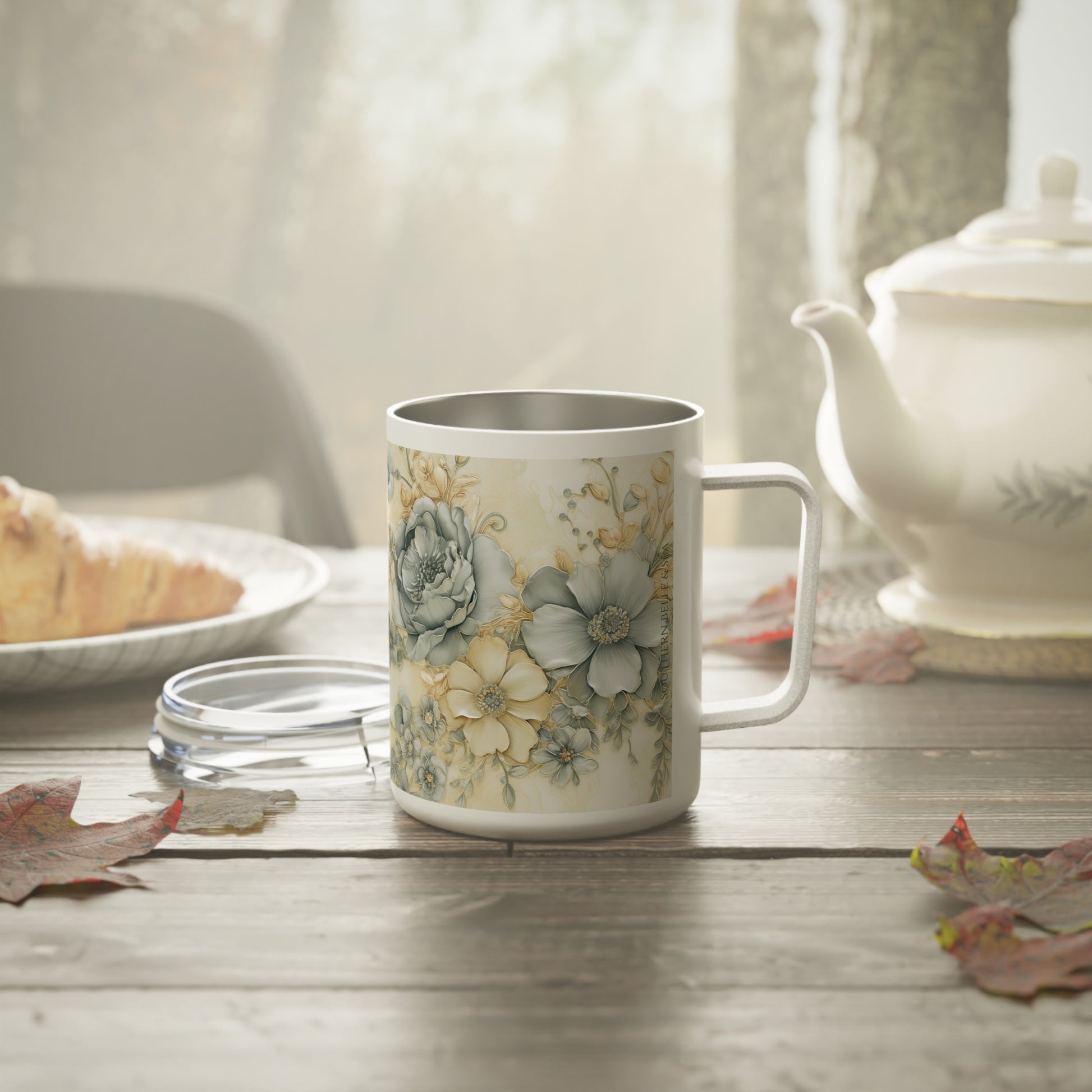 Styled scene: Floral Serenity insulated mug on table