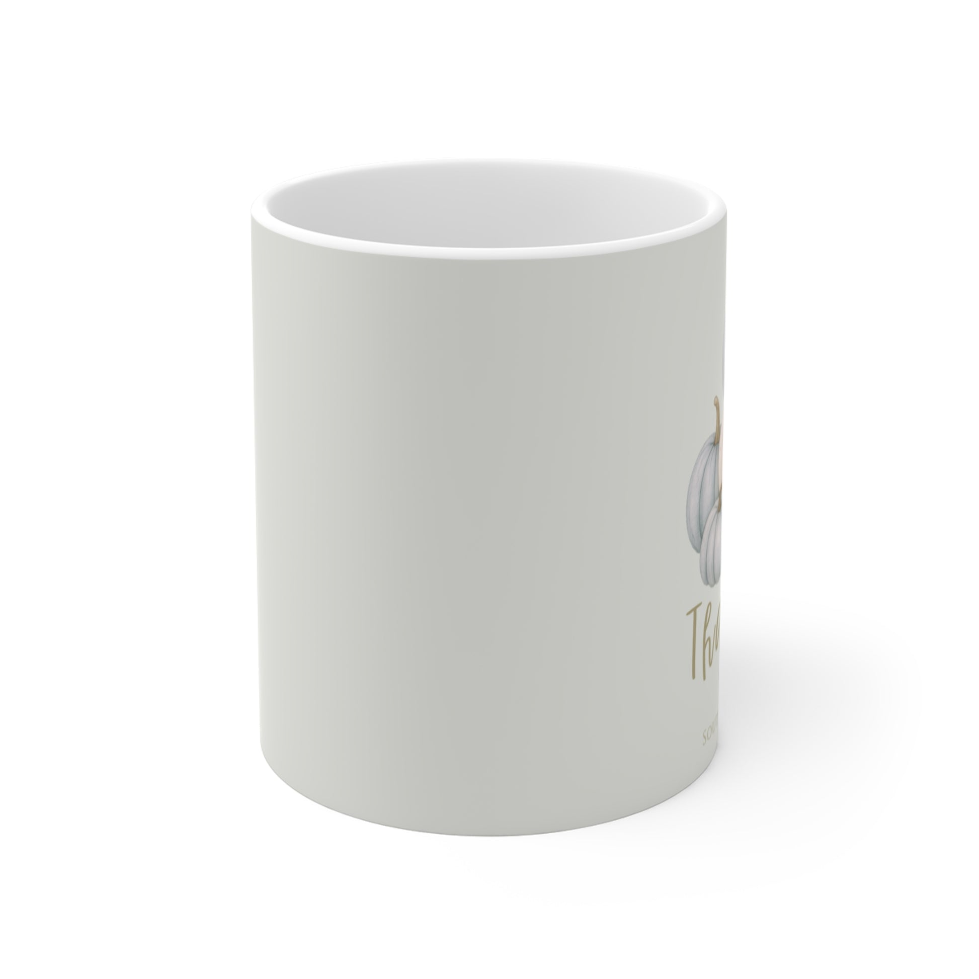 White mug with a printed design on a white background