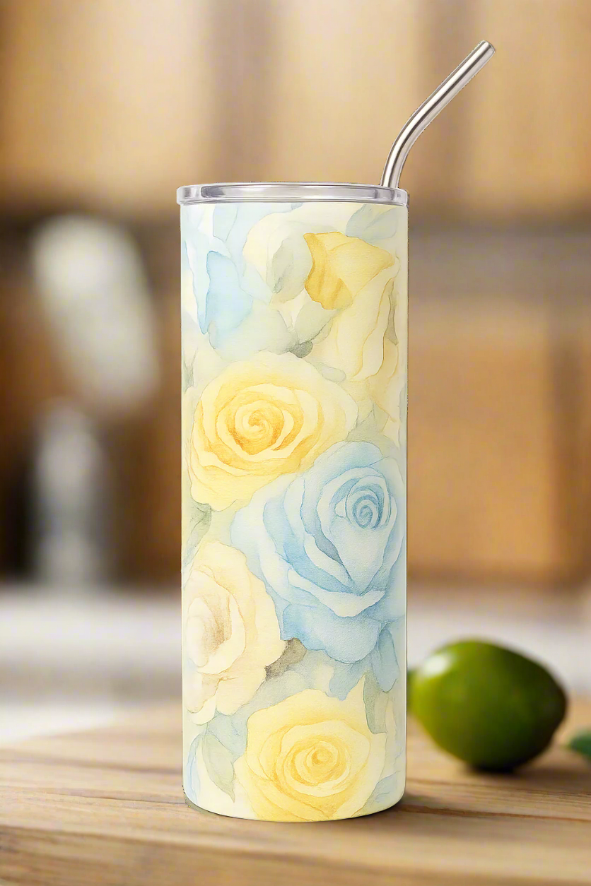 Tumbler with floral design and metal straw on a white background