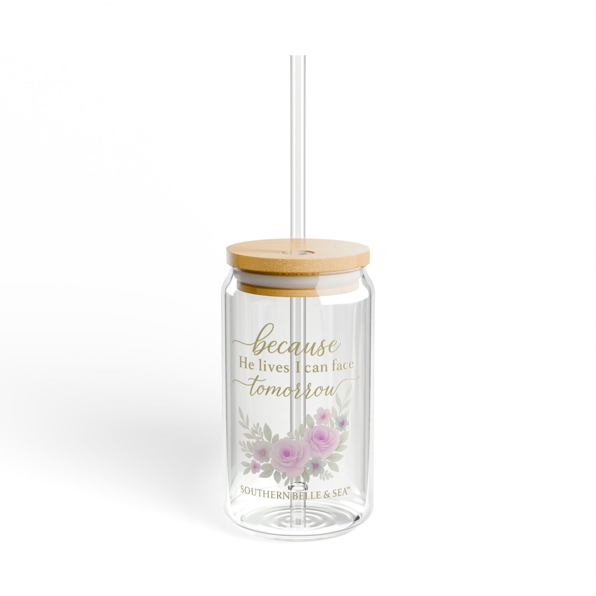 Clear tumbler with floral design and text on a white background