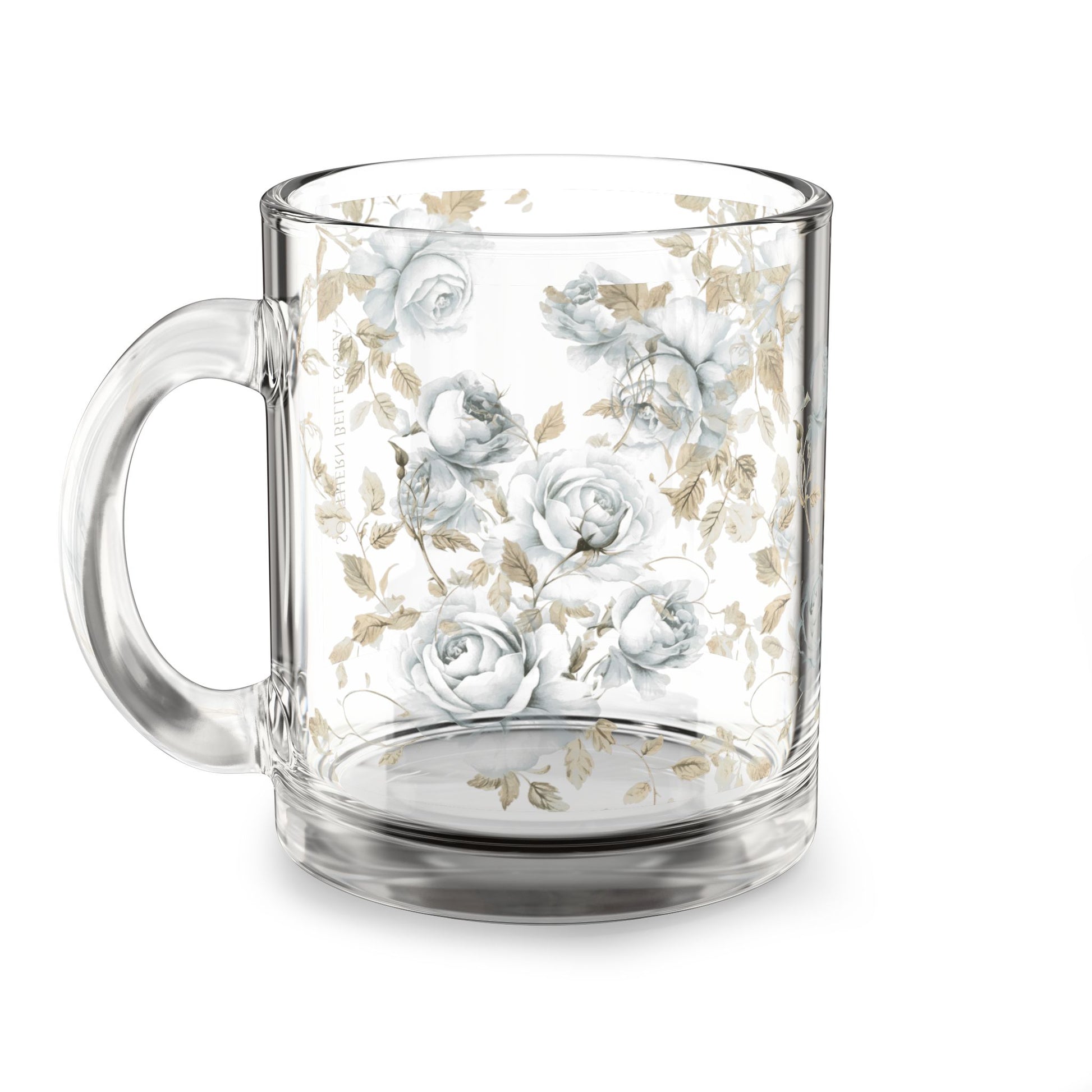 Clear glass mug with floral design on a white background