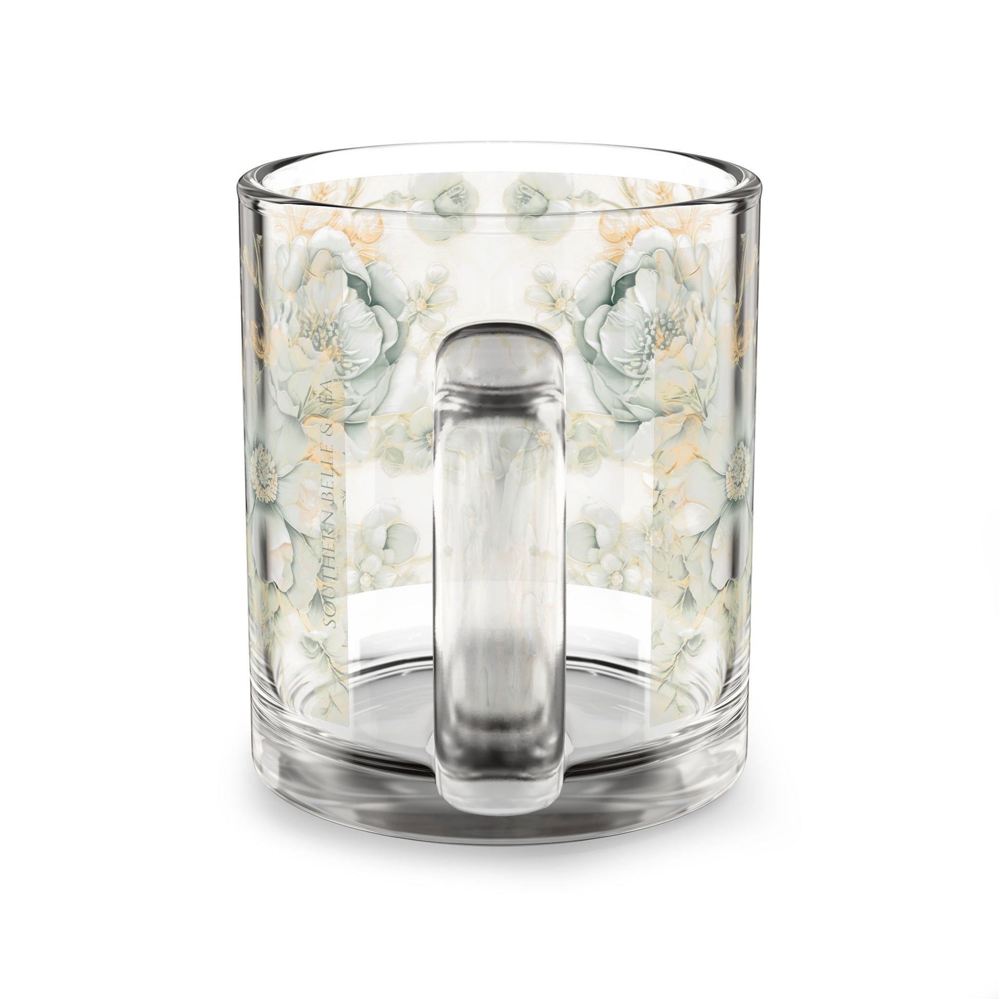 Clear glass mug with floral pattern on a white background