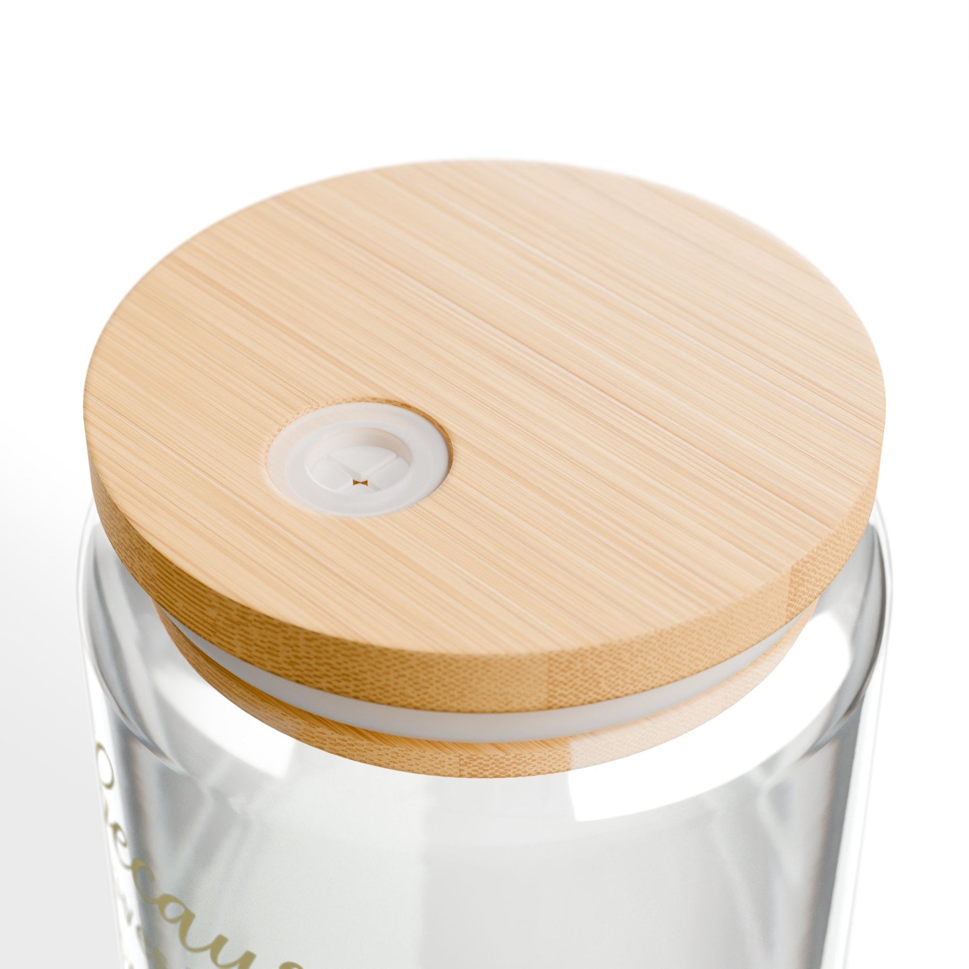 Clear glass container with a wooden lid on a white background