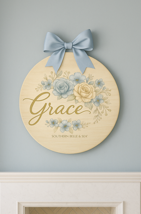 Decorative wall plaque with floral design and 'Grace' text on a gray wall.