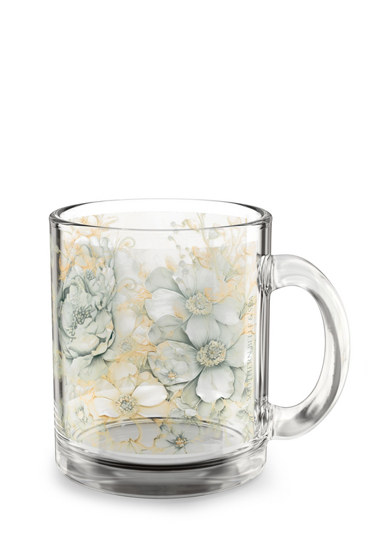 Clear glass mug with floral design on a white background