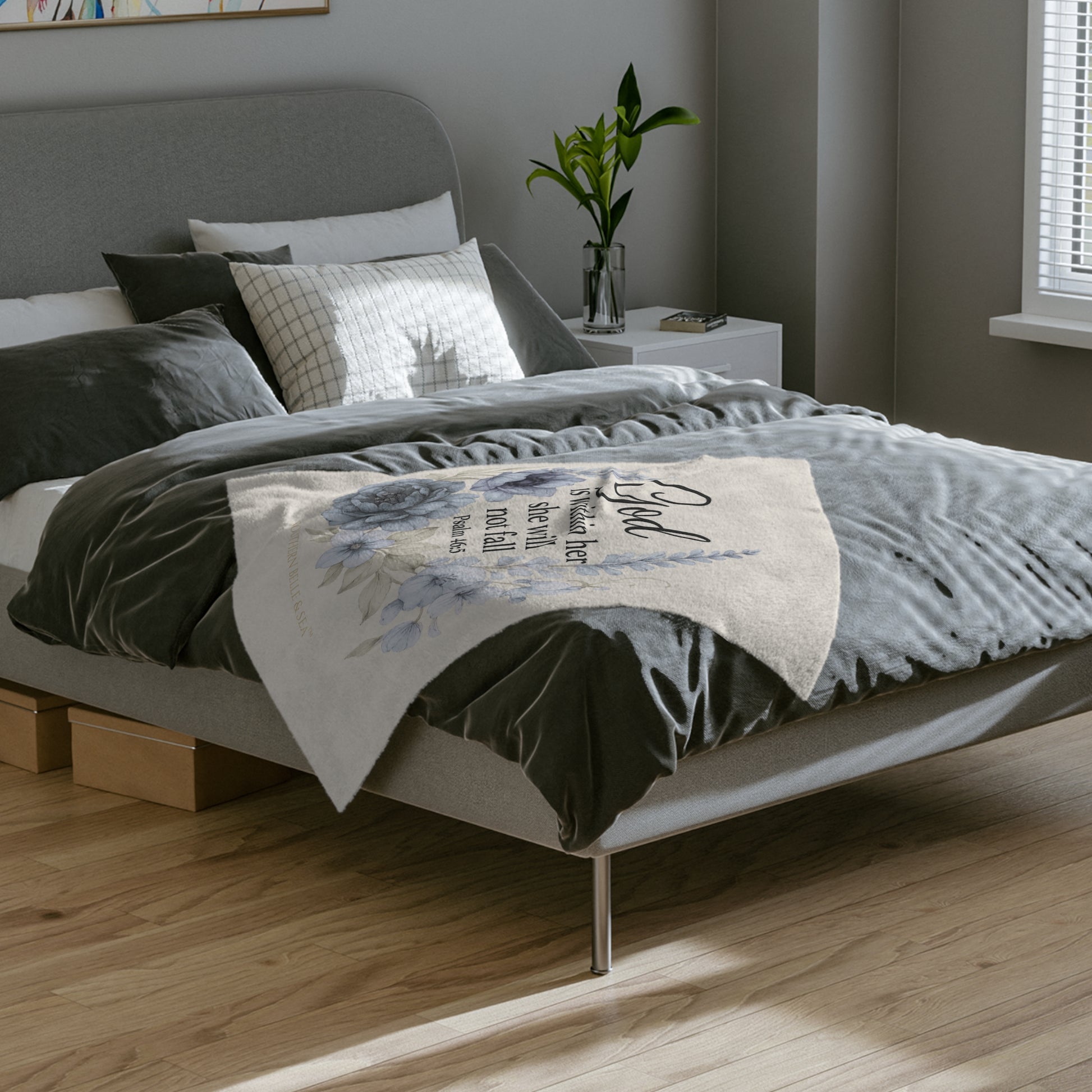 Ivory fleece scripture blanket with God Is Within Her She Shall Not Fail design styled on bed, Christian home décor