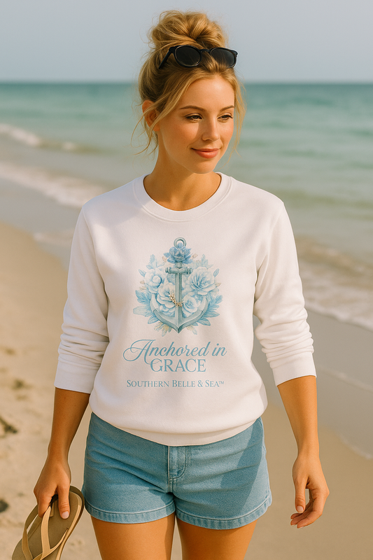 Anchored in Grace Premium Sweatshirt | Woman walking on the beach wearing white sweatshirt with blue anchor and floral design, Southern Belle & Sea™.
